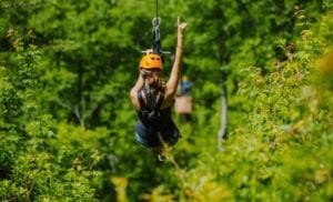 girl ziplining in the smoky mountains