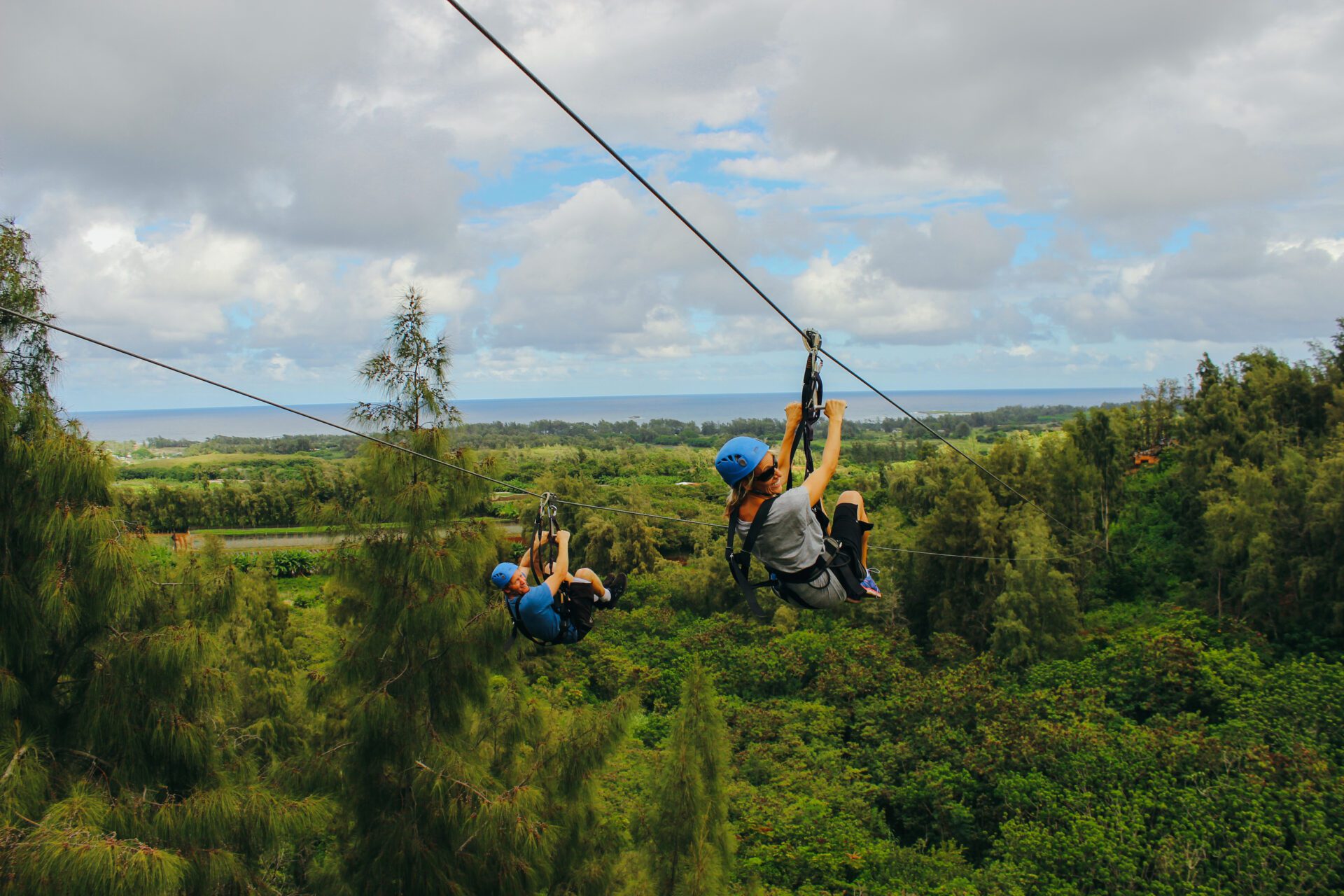 A happy couple taking an Oahu zipline adventure.