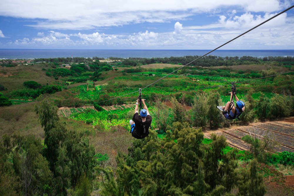 A man and a woman enjoying our Oahu zipline course.