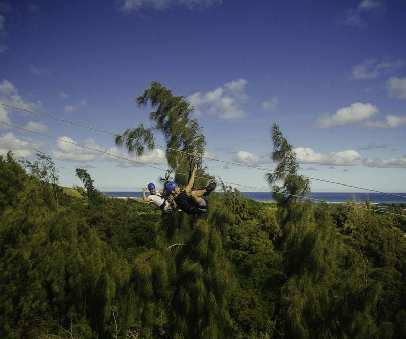 two men ziplining in oahu