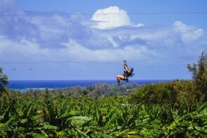 woman ziplining in oahu