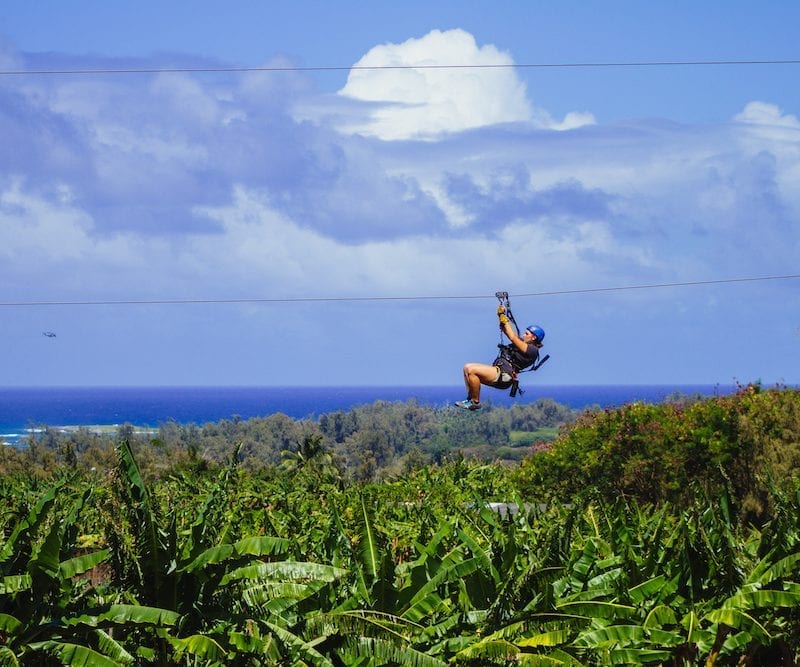 woman ziplining in oahu