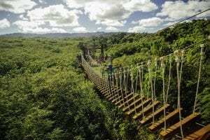 guy walking across bridge at Keana Farms