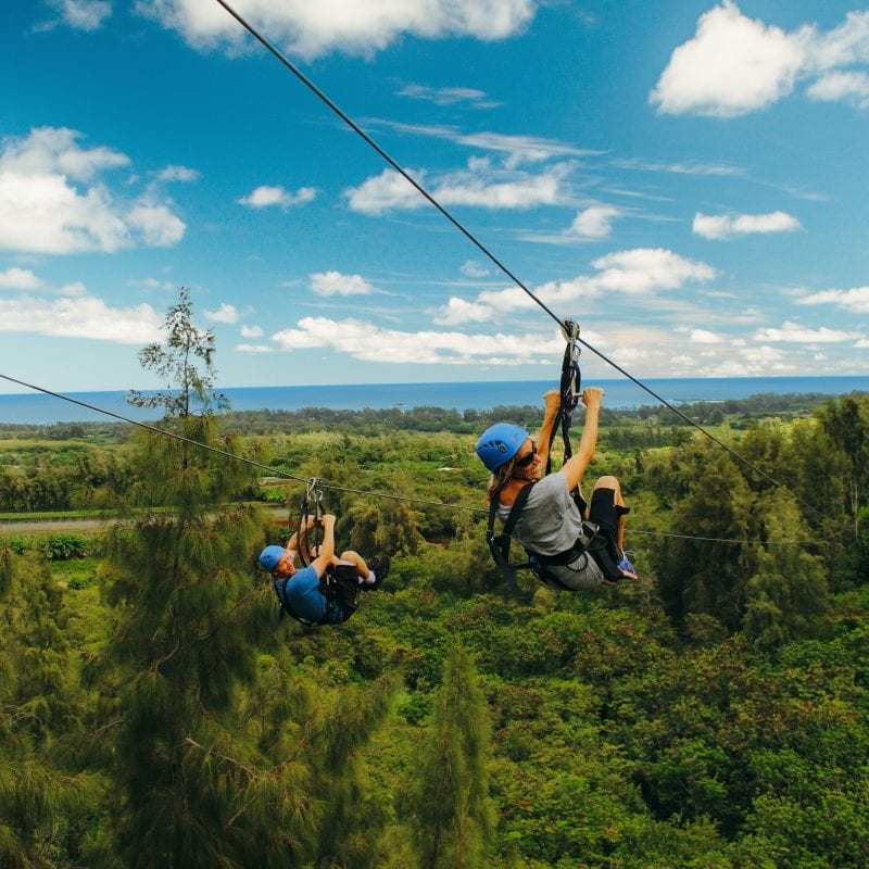 friends ziplining in oahu for the first time