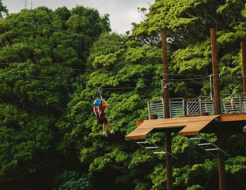 girl ziplining in Oahu