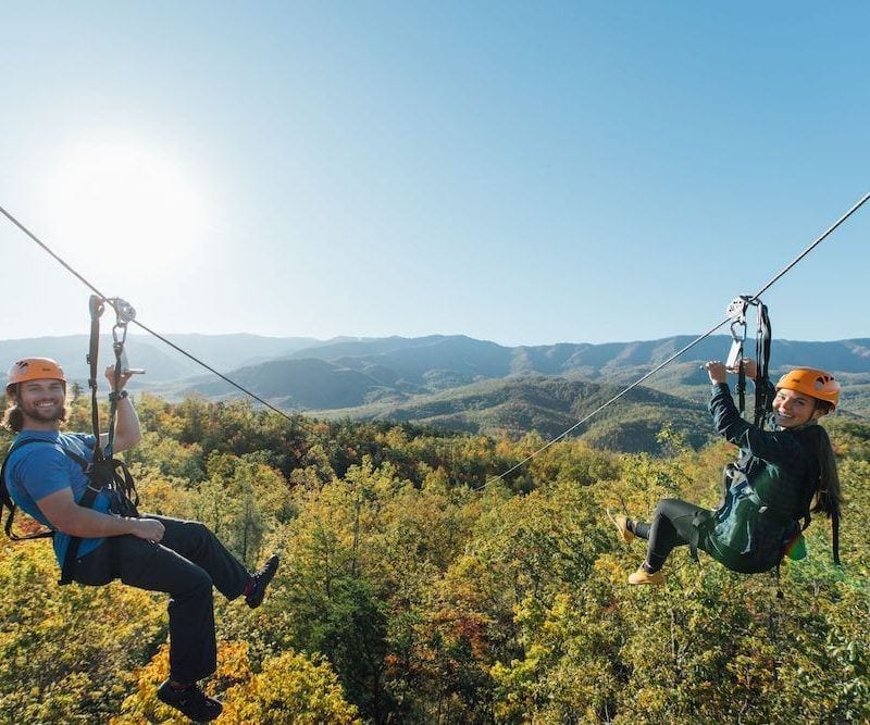 people ziplining in the smoky mountains