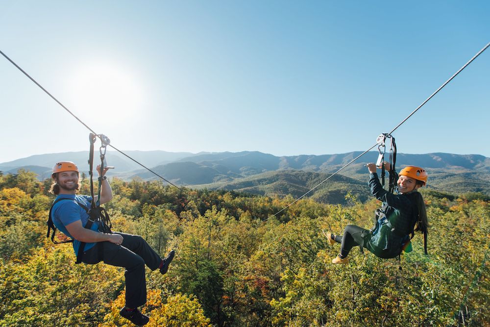people ziplining in the smoky mountains