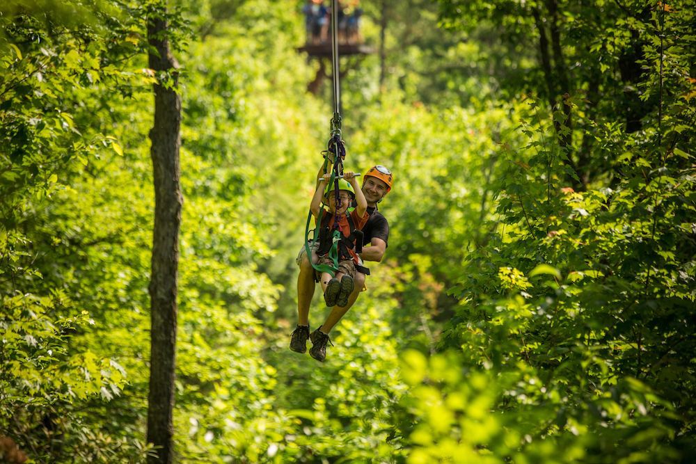 dad and son ziplining in gatlinburg