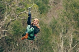 girl ziplining in gatlinburg