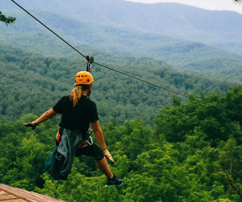 girl ziplining in the smoky mountains