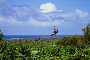 woman ziplining in oahu solo